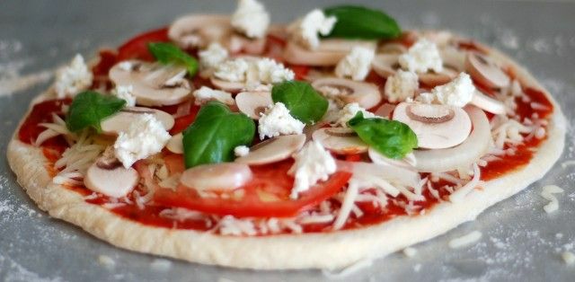 pizza-ingredients-on-pizza-dough